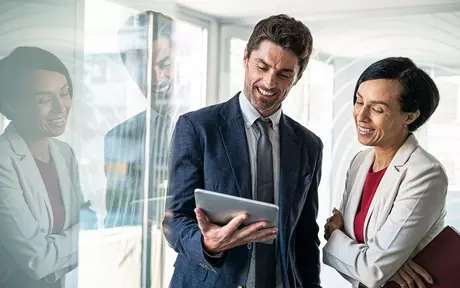 Smart dressed man and woman talking